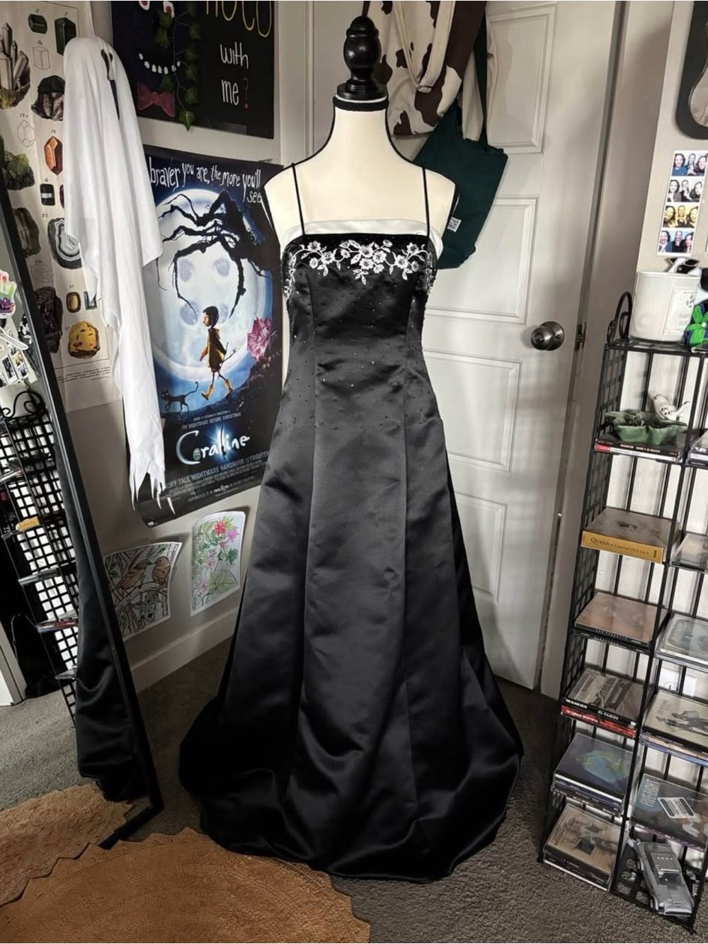 Betsy & Adam Black Satin Prom Gown with White Floral Accents